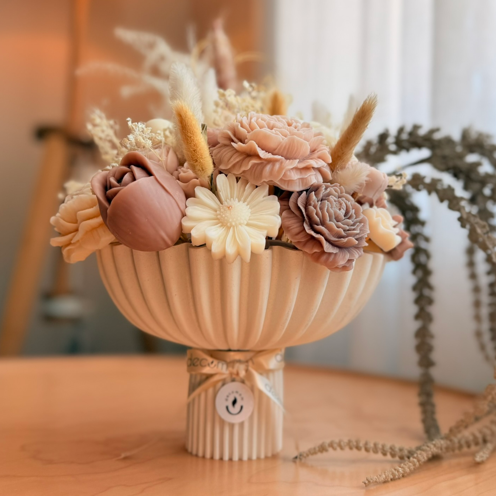 A image of a concrete sphere, balanced between two other larger spheres